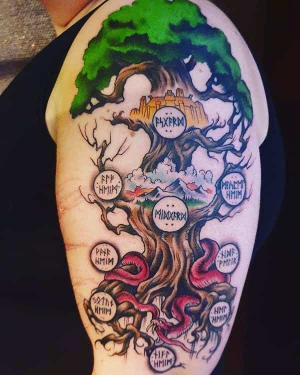 The tattoo depicts Yggdrasil, the Norse tree of life, with vibrant colors, runic symbols, and serpents winding around its roots and branches.