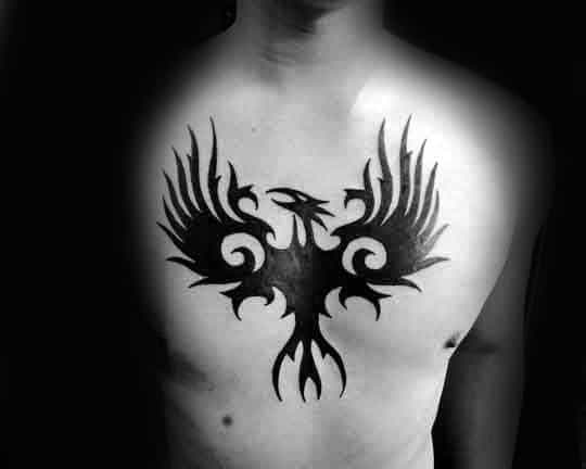 Middle Of Hest Tribal Eagle Tattoo On Man