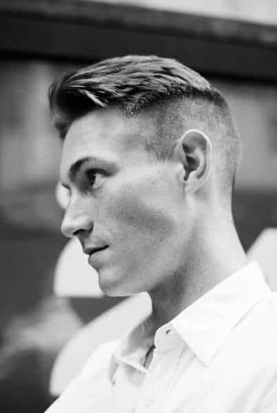 Classic side part with a high fade and neatly combed top