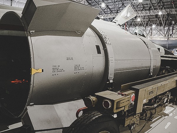 Military Bomb With Carrier Wings Over The Rockies