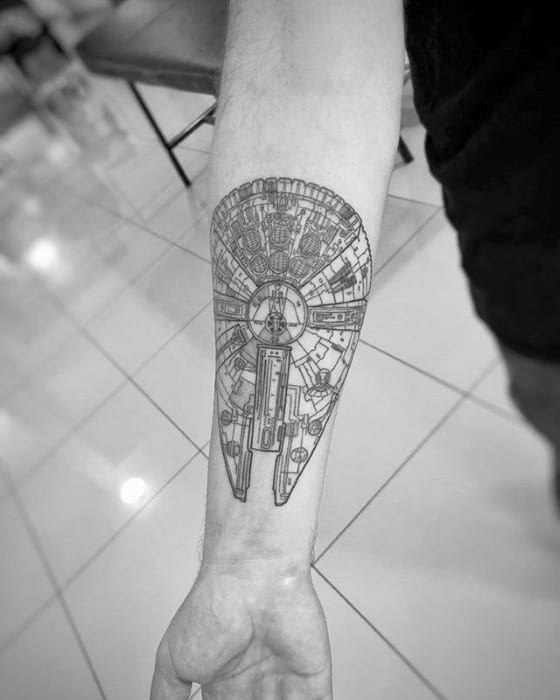 Large, detailed Millennium Falcon tattoo in fine black lines running vertically along the forearm with symmetrical, technical precision.