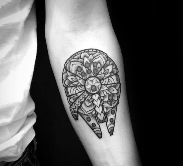 Mandala-style Millennium Falcon tattoo with floral patterns replacing mechanical details, blending sci-fi with geometric artistry.