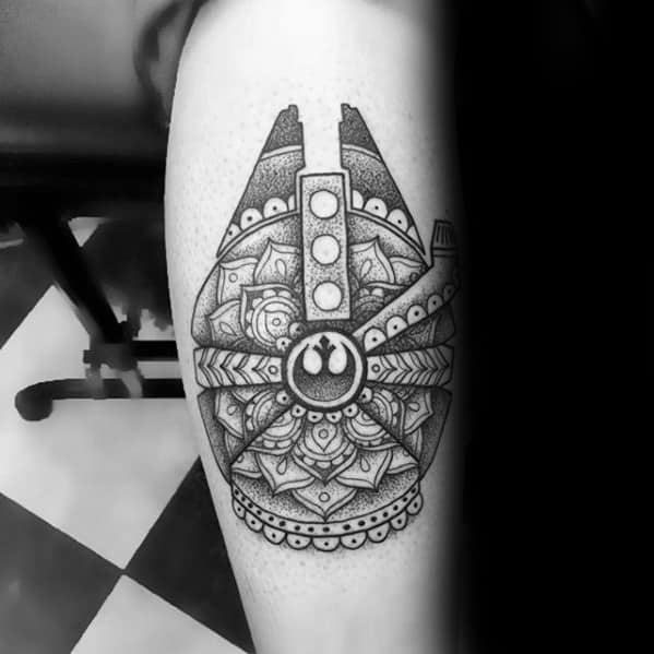 Geometric Millennium Falcon tattoo with dotwork detailing, floral mandala patterns, and a Rebel Alliance symbol at the center.
