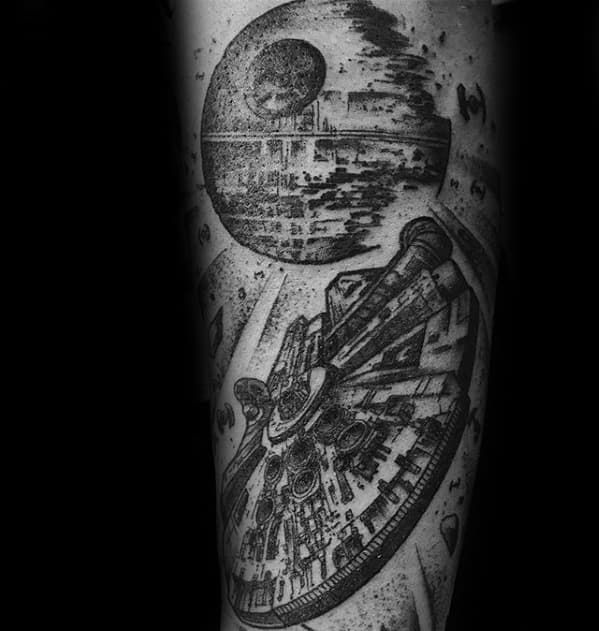 Highly detailed black and grey Millennium Falcon tattoo flying toward the Death Star, with dotwork shading and dramatic space effects.