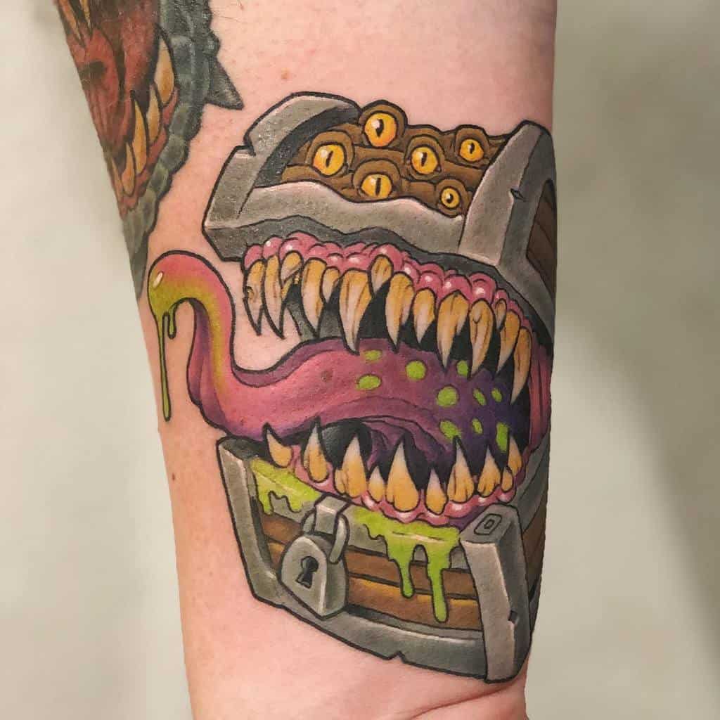 Vibrant Dungeons & Dragons tattoo of a Mimic, a treasure chest with sharp teeth, a drooling tongue, and eerie yellow eyes
