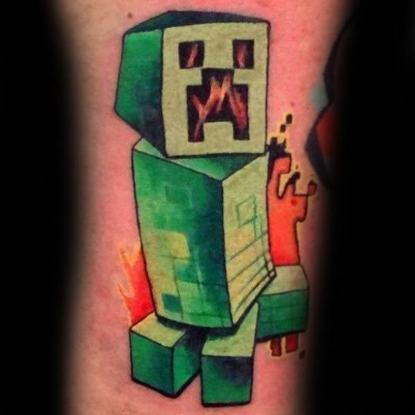 Vibrant Minecraft Creeper tattoo with pixelated green blocks and fiery red-orange background, giving it a dynamic exploding effect.