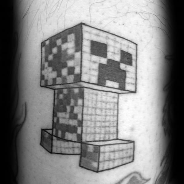 Black and grey Minecraft Creeper tattoo with pixel shading, done in a sketch-like style for a classic monochrome look.