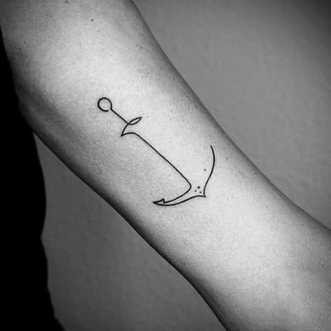 Minimalist anchor tattoo on a forearm