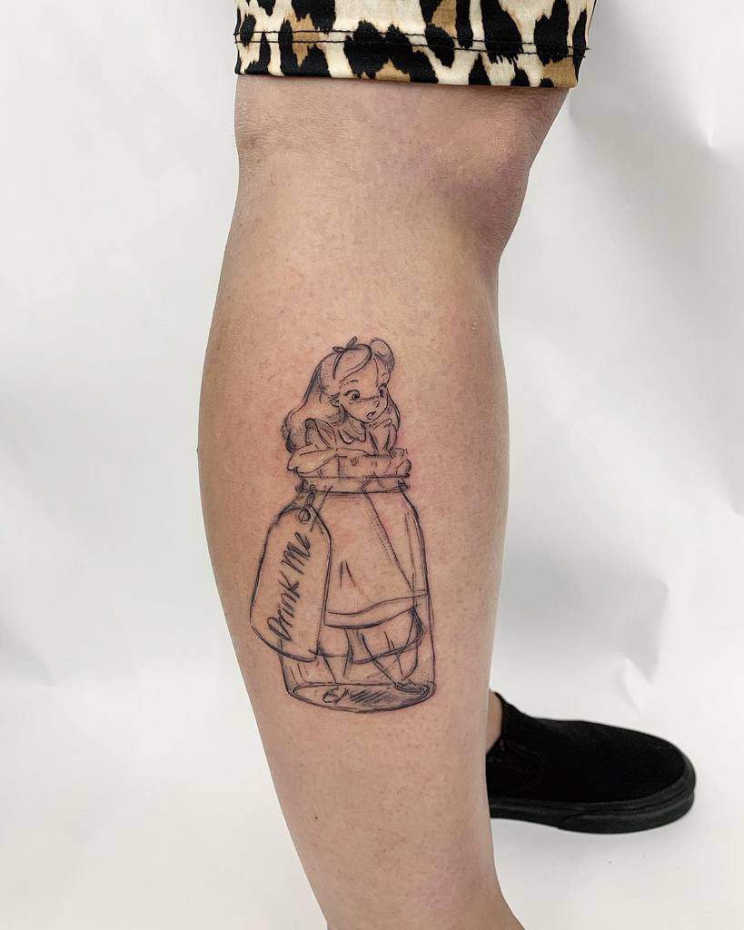 Black and white tattoo of Alice from Alice in Wonderland, inside a bottle labeled 'Drink Me'