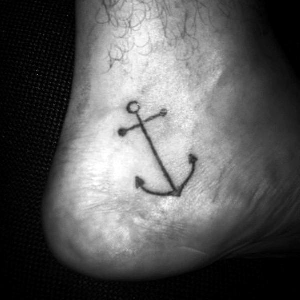 Tattoo of an anchor on the side of a 
foot