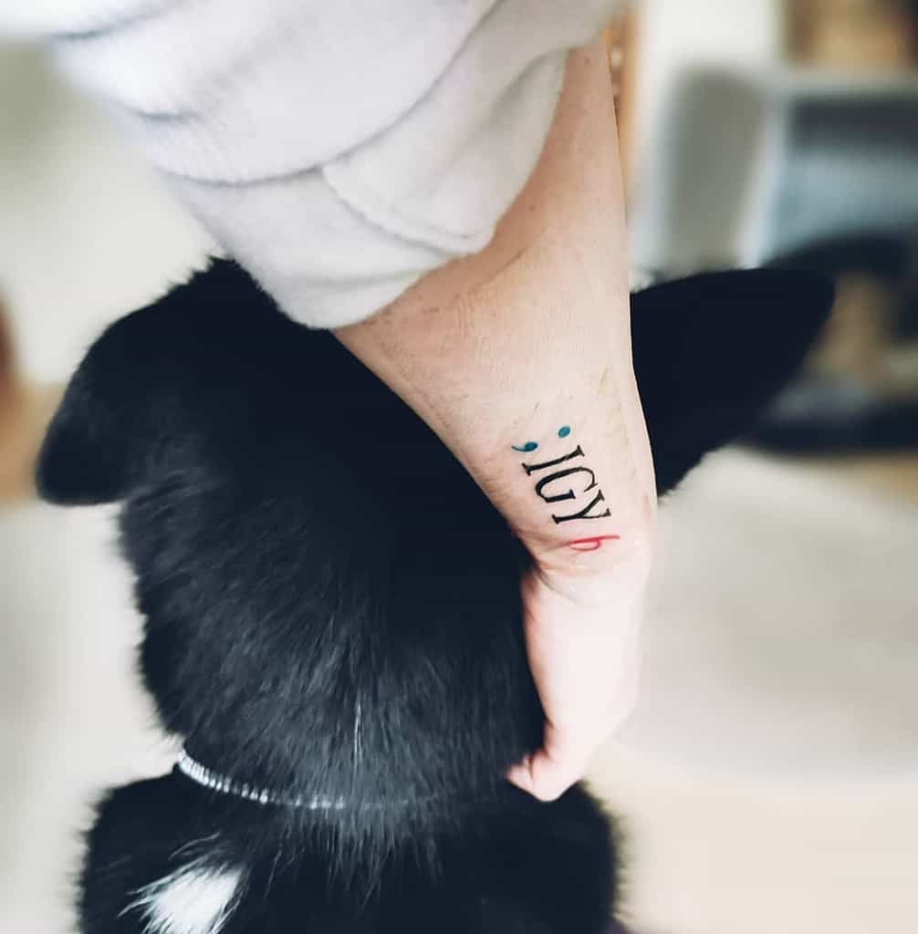Person with ";IGY6" tattoo on wrist