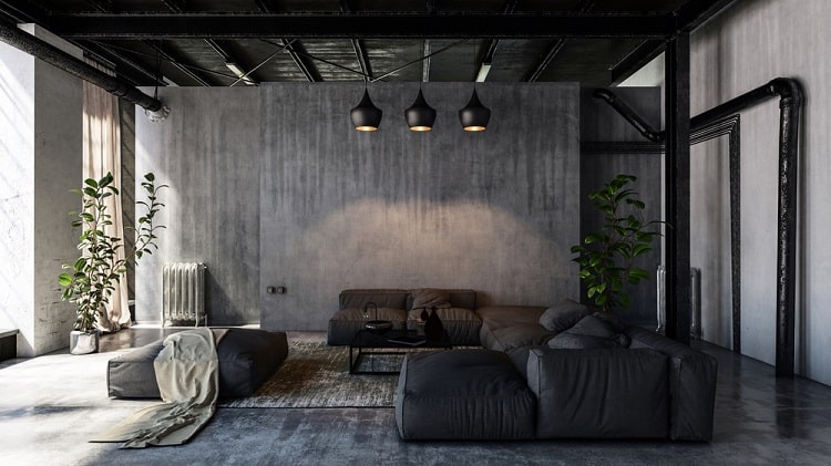 A minimalist living room with an unfinished ceiling, exposed beams, dark sofas, and modern pendant lights, creating a spacious urban feel