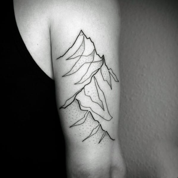 Minimalist mountain tattoo on the upper arm, featuring fine lines, abstract peaks, and subtle dot shading for a modern and artistic landscape design.