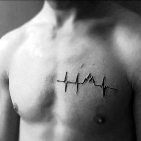 Minimalist heartbeat mountain tattoo on the chest, featuring an ECG line blending into mountain peaks for a unique and symbolic design.