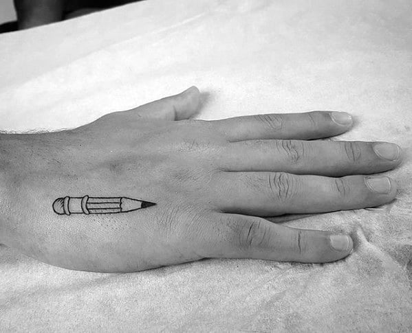A hand adorned with a pencil tattoo on the side gracefully rests on a pristine white surface