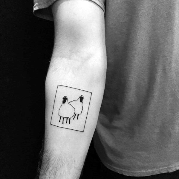 Simple tattoo of two sheep inside a square on a person's inner forearm