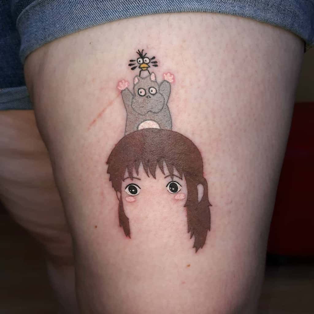 Cute tattoo of Chihiro from Spirited Away with Boh and Yu-Bird stacked on her head, featuring soft colors and playful expressions