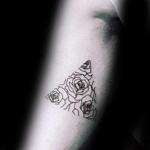 Tattoo of roses within an outlined triangle on an arm