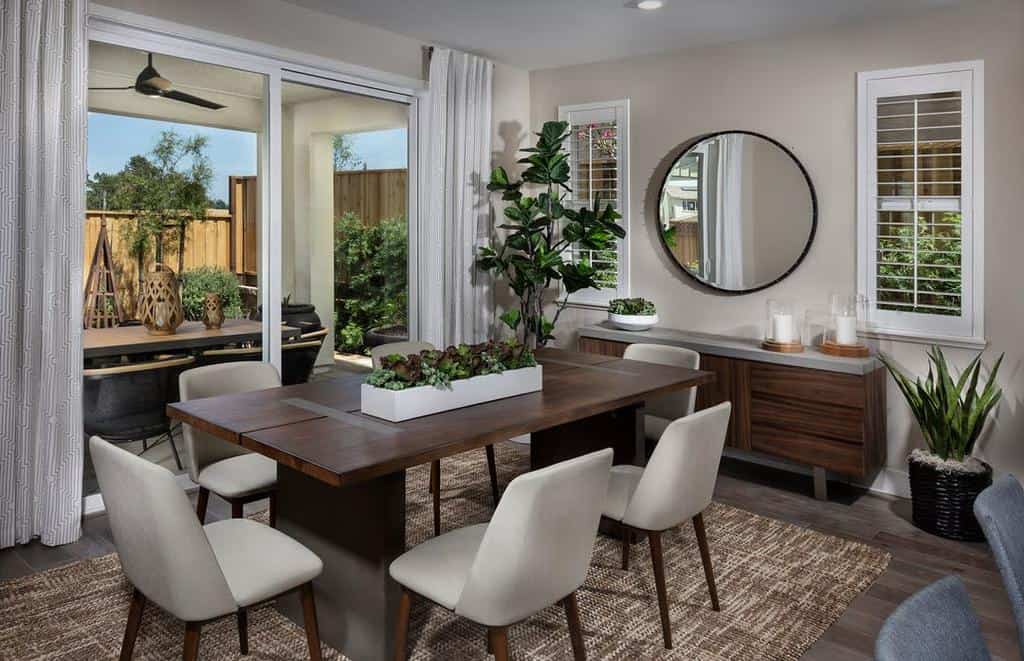 smart dining room table and chairs large wall mirror plants