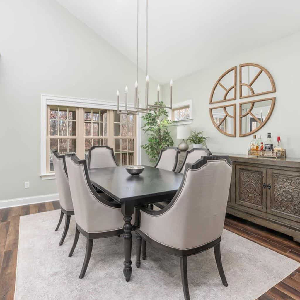 elegant dining room table and chairs wood cabinet circular broken wall mirror 