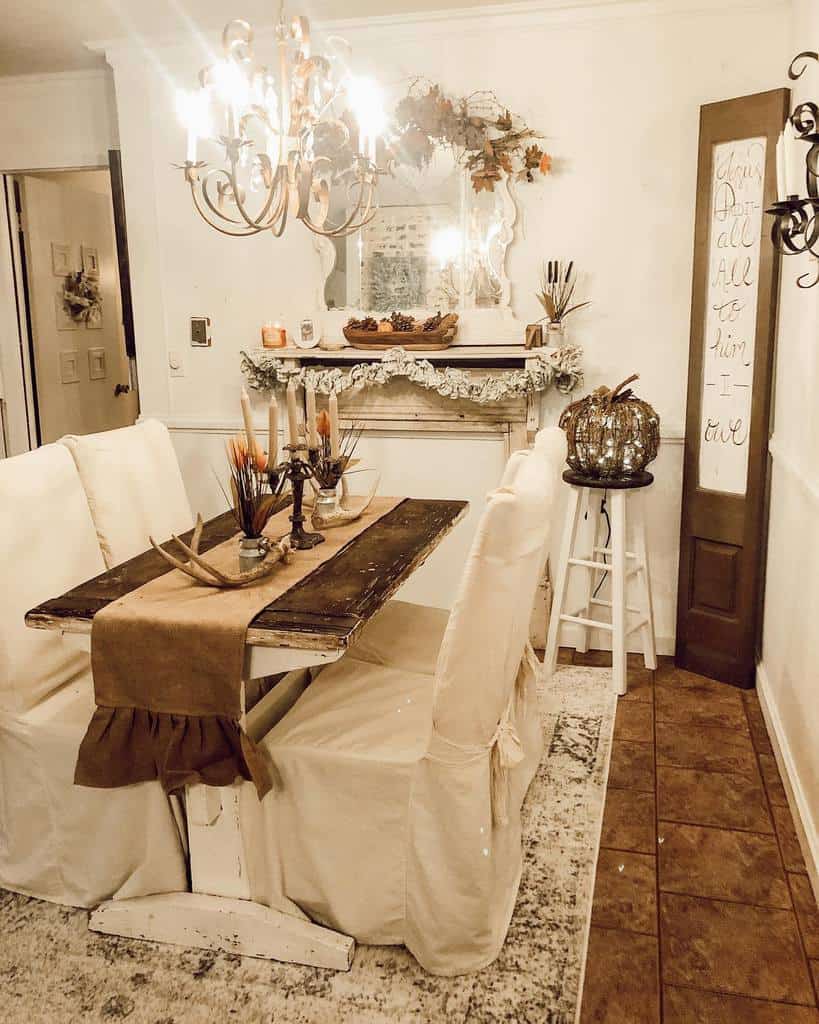 rustic dining room wood table white chairs chandelier wall mirror