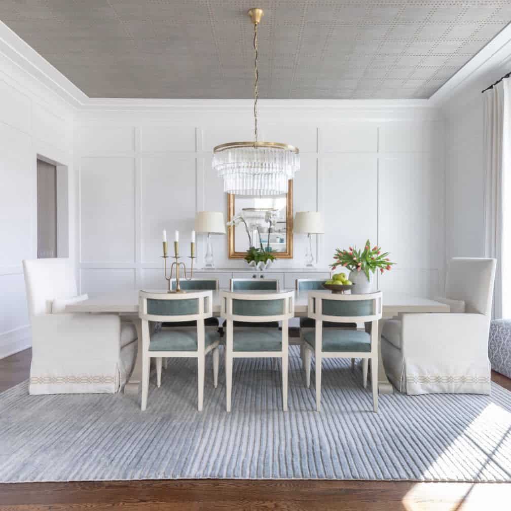 large white and gray dining room glass chandelier with gold accents gold trim mirror gold candlestick 