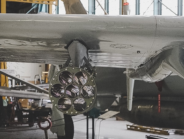Missle System Attached To Aircraftwings Over The Rockies