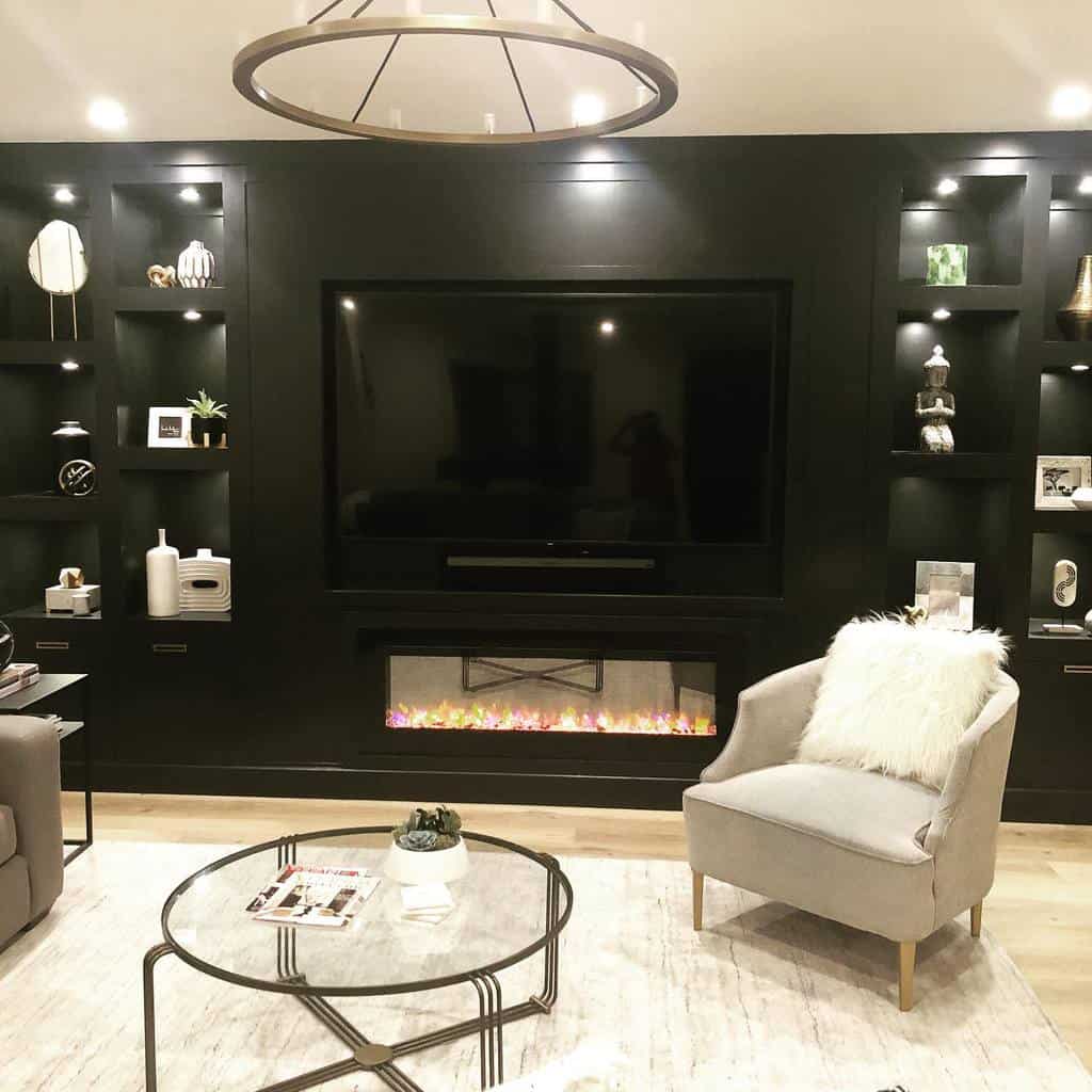 Contemporary living room with built-in fireplace, large TV, and sleek shelving for decor displays.