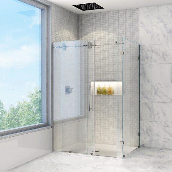 Modern shower with glass enclosure, mosaic tile walls, and recessed illuminated shelf.