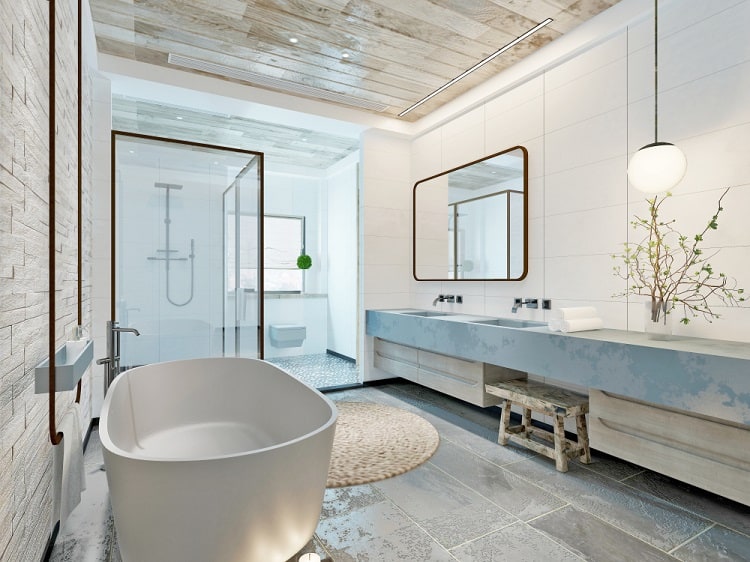 A modern bathroom with a freestanding bathtub, large mirror, and a wooden ceiling that adds a natural, rustic touch