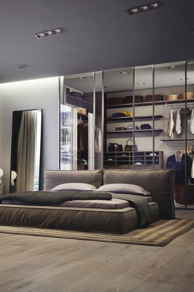 bachelor bedroom with platform bed and large walk-in wardrobe 
