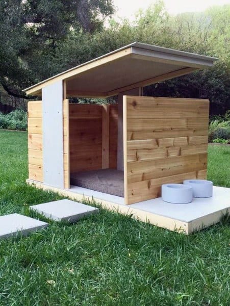 Modern wooden dog house with a slanted roof