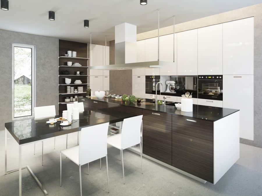 Modern kitchen with black island, white cabinets, open shelves, and dining table with chairs.