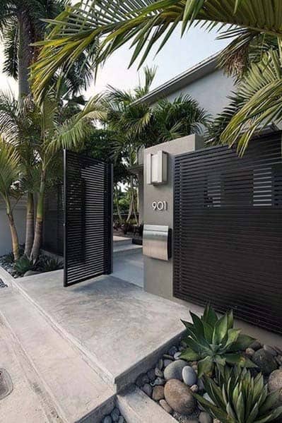 modern black painted metal and stainless steel front yard fence 