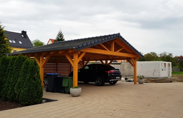 modern black roof carriage house carport