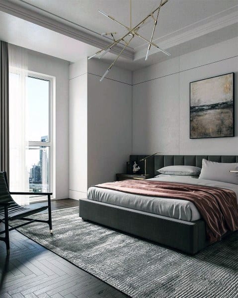 Modern bedroom featuring a unique light fixture, stylish rug, and contemporary decor elements.