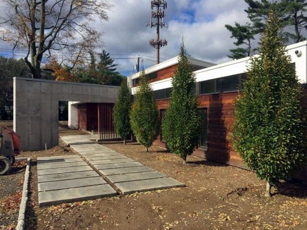 concrete steps with landscaping pebbles 