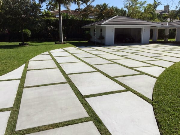 concrete paver driveway with grass joints
