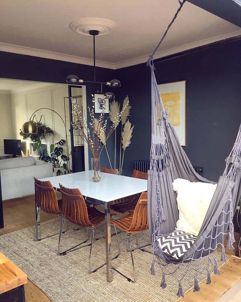 modern dining room blue walls white ceiling hammock sputnik chandelier dining room table and chairs