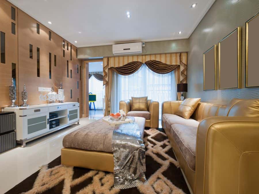 modern family room gold couches white cabinet elaborate curtains 