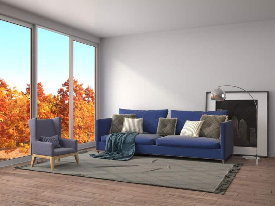 modern family room blue couch purple accent chair silver floor lamp