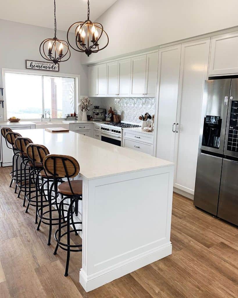 modern white farmhouse kitchen wood stools modern fridge 
