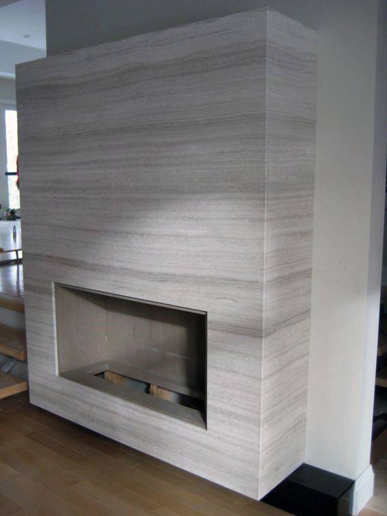 Sleek minimalist fireplace with striped stone cladding and modern design.