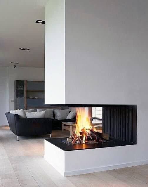 Contemporary three-sided fireplace with a suspended design, blending seamlessly into an open-concept living space for a modern, cozy feel.
