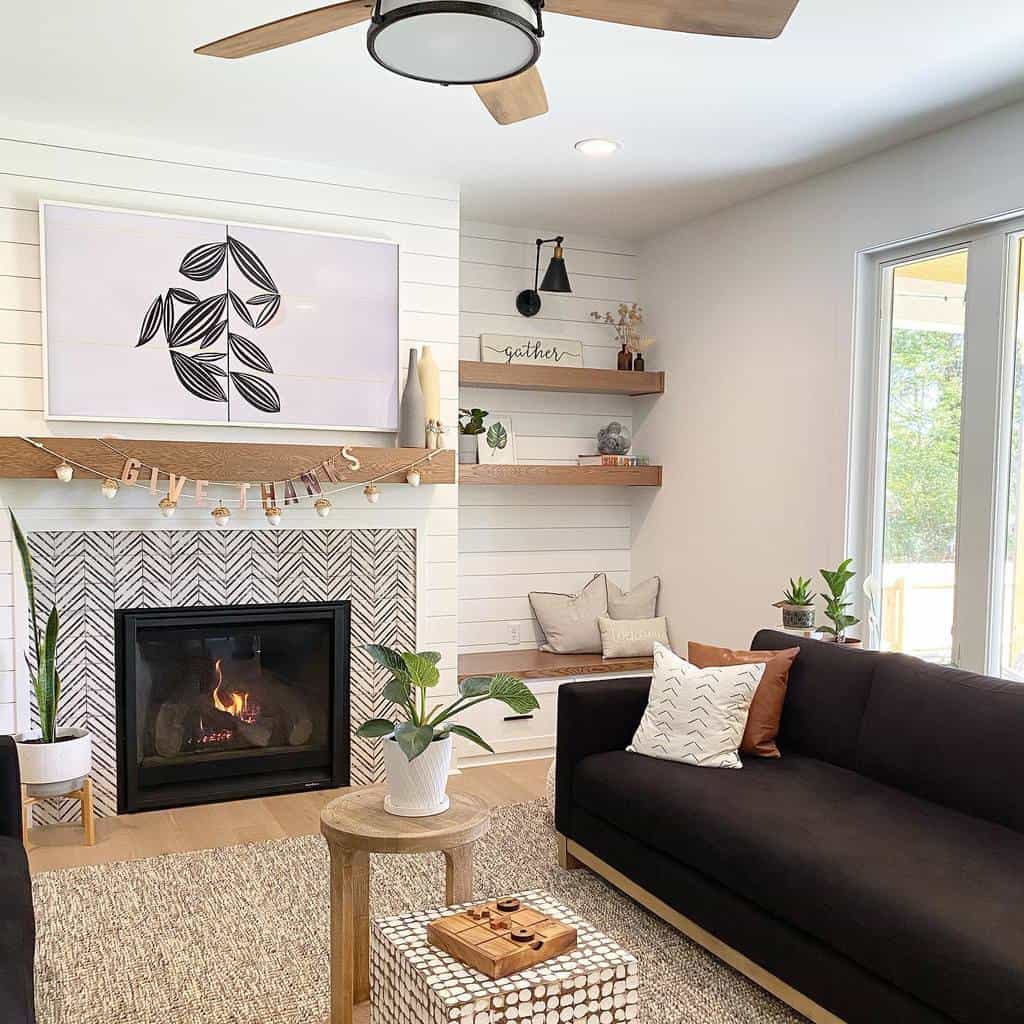country style living room black sofa tile fireplace shiplap walls
