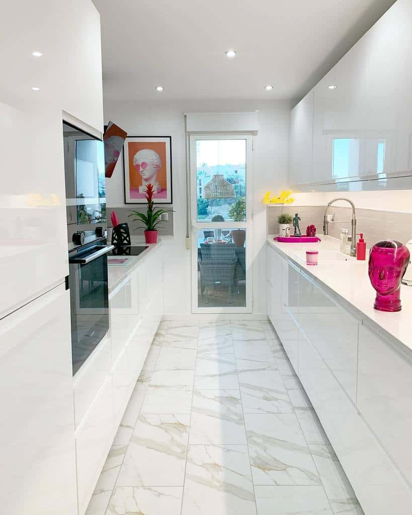 modern galley kitchen sleek white cabinets pop art tile flooring