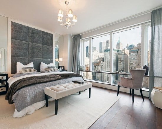 modern apartment city view large gray square headboard ottoman