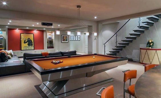 basement games room billiard table orange seats large sofa 
