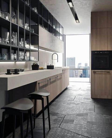 Minimalist galley kitchen with open shelving, sleek countertops, and cityscape views.