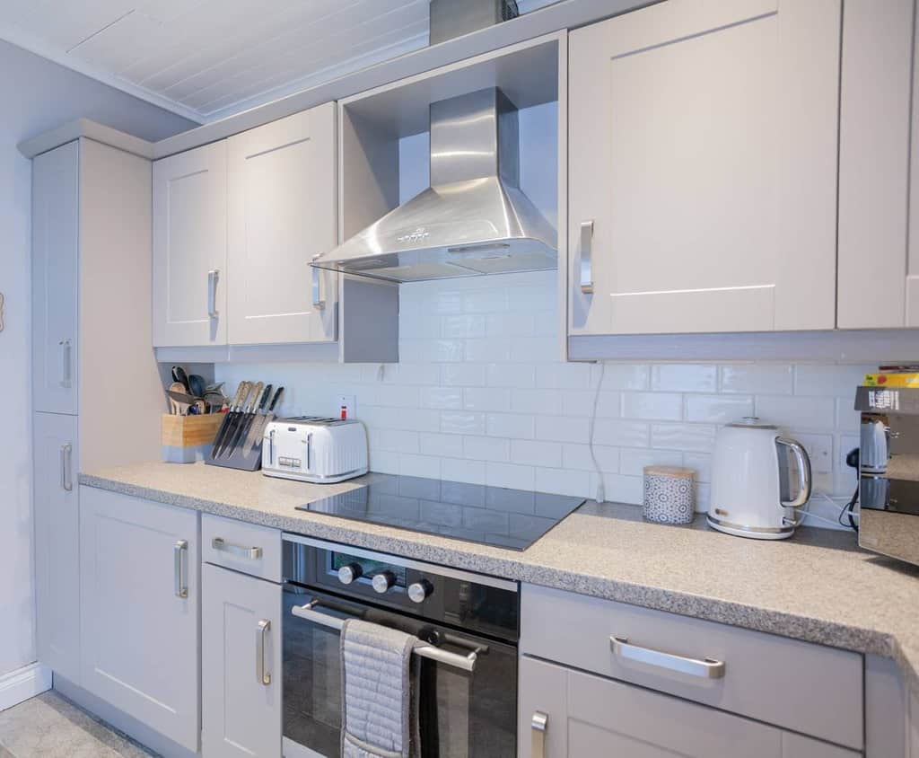 modern white kitchenette tile backsplash